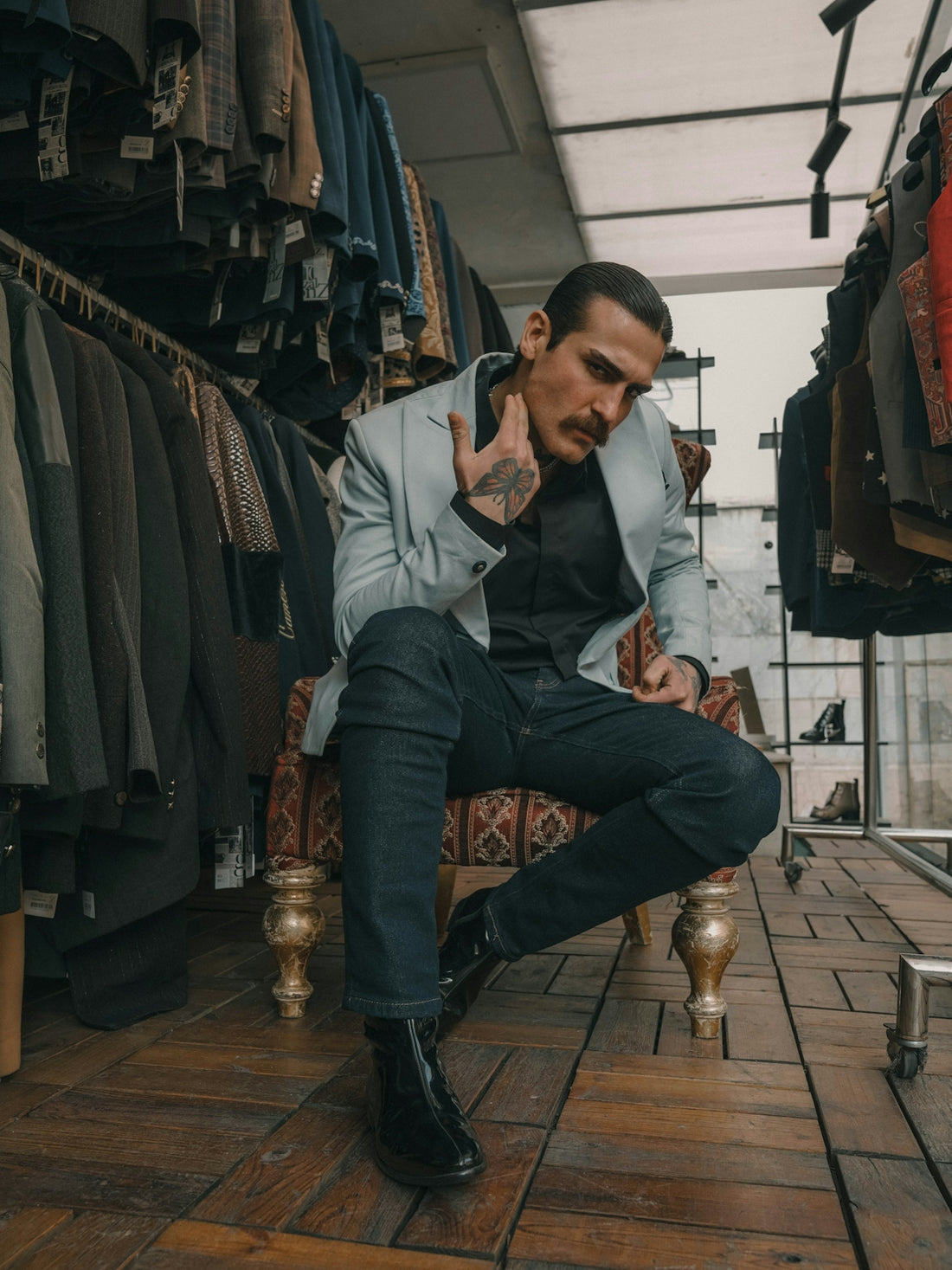 Stylish man posing in a clothing store.
